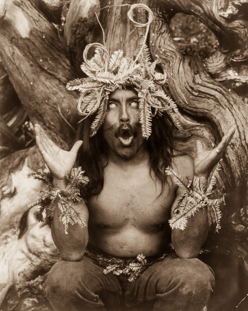 1914, A Kwakiutl shaman performs a religious ritual.