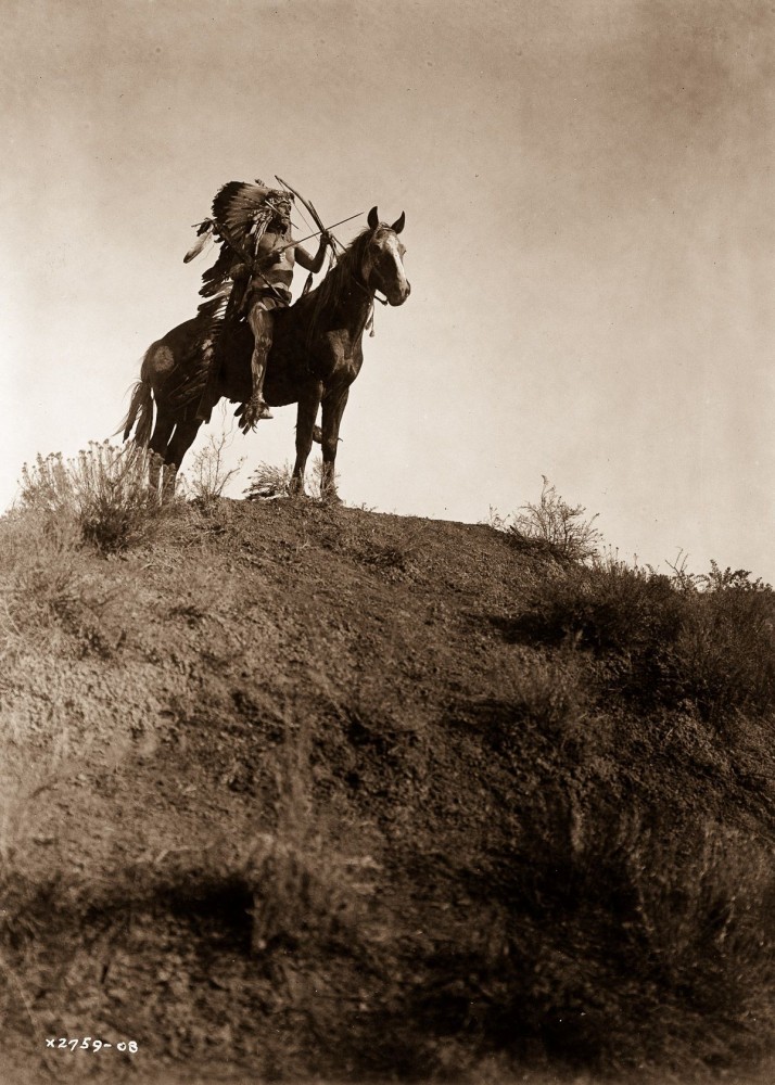 1908, An Apsaroke man on horseback.